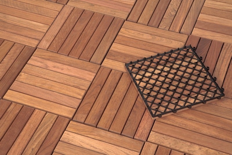 What is the plastic grid of the click wood tiles made of?